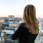 A girl looking out at the Aberdeen cityscape.