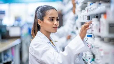 Female student doing an experiment in a laboratory