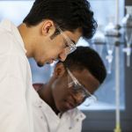Scientists working together in a laboratory environment.