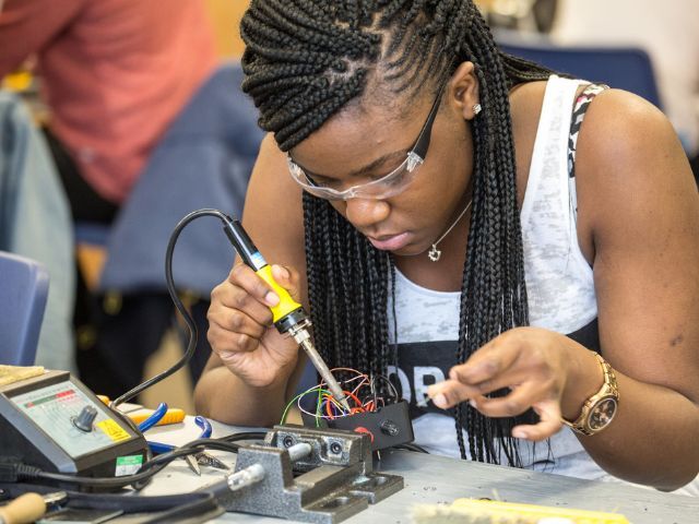 Girl performing engineering task