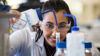 Girl doing science experiment in lab